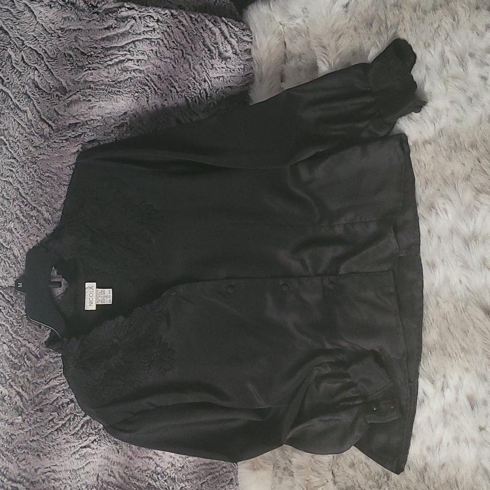 Vintage black polyester blouse with floral embellishments around neck and cuffs